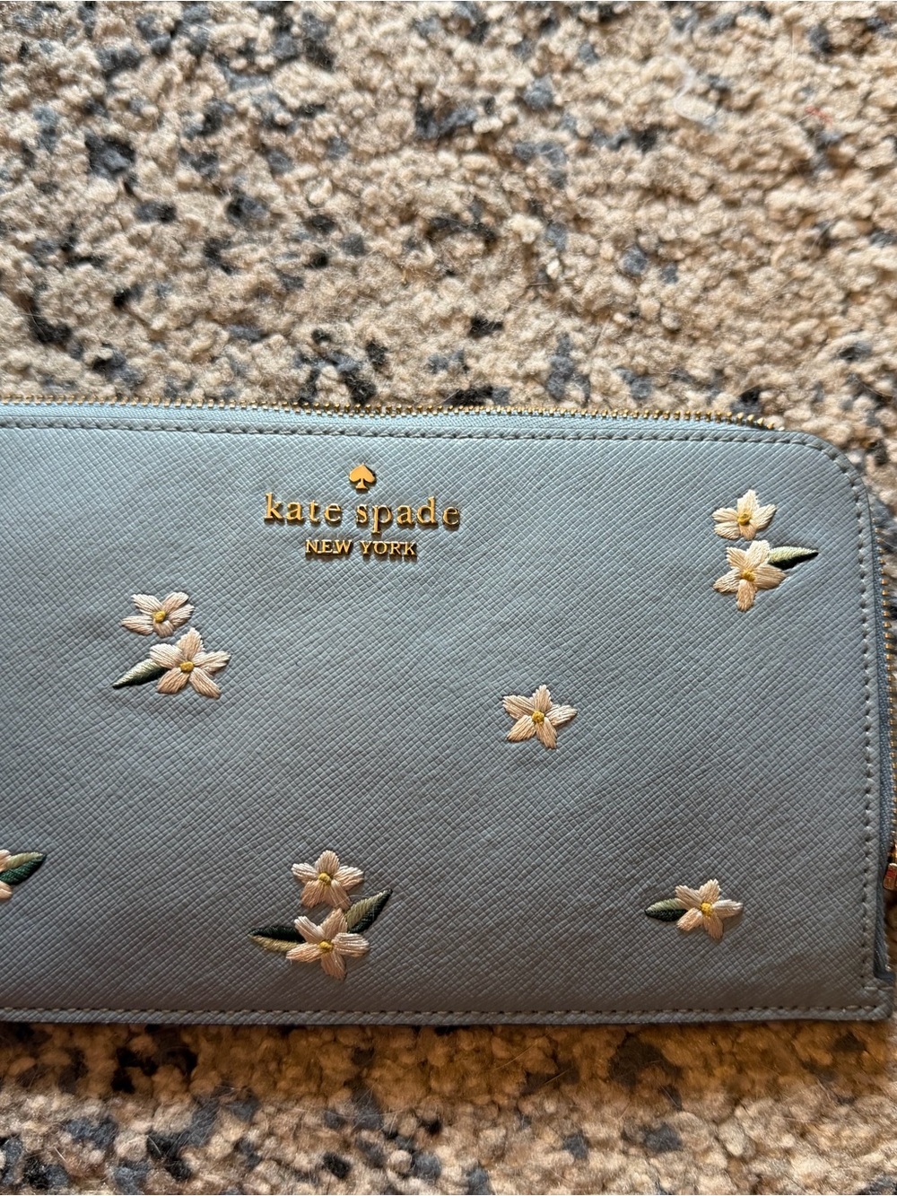 kate spade light blue floral zip-around wallet with gold logo